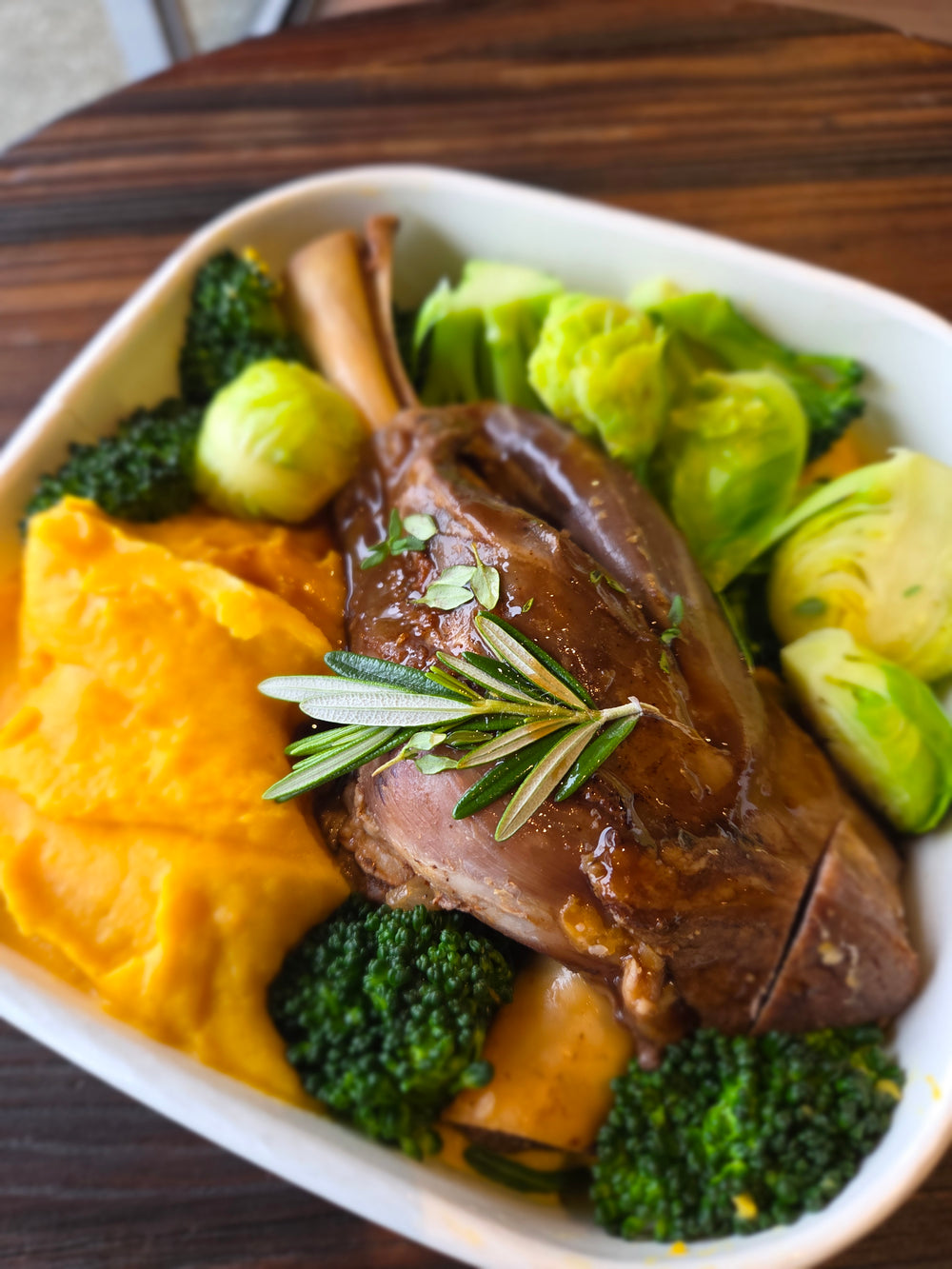 Slow cooked lamb shank, kumara mash, green veg & rosemary jus